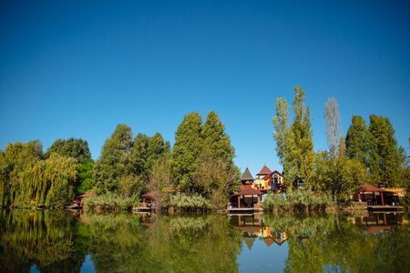 Landscape in city park with lake.の写真素材