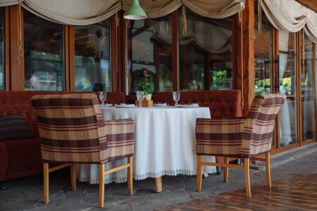 Table setting in the restaurant. A fragment of the interior.の写真素材