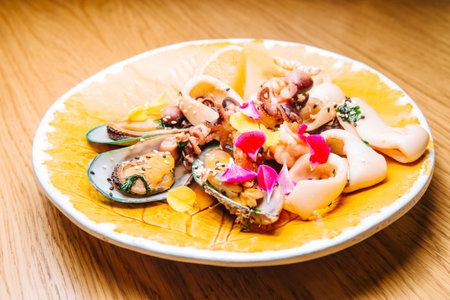 Tasty and fresh salad with mussels, squid. 