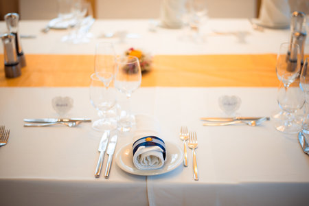 Table setting in the restaurant. A fragment of the interior.