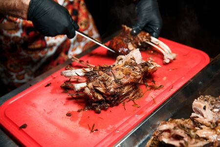 The cook cuts the cooked meat.の写真素材