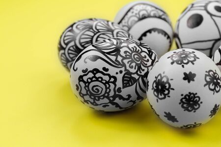Easter eggs are painted black and white, abstraction, laid out in a circle.の写真素材