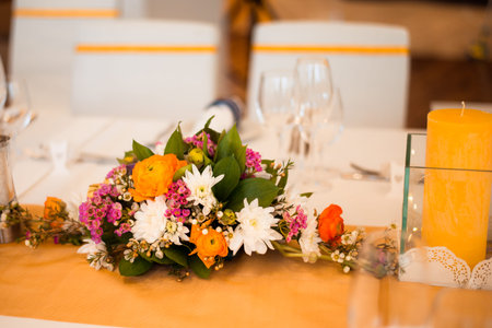  Elegant banquet table setting with flowers and candles.の写真素材