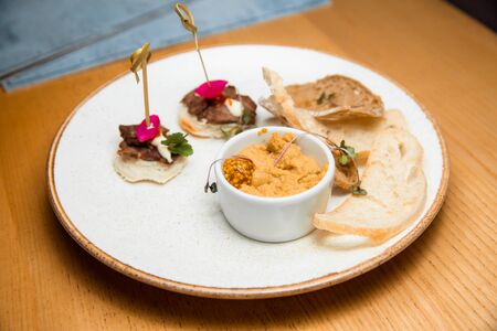 Fresh pate served with slices of bread.の写真素材