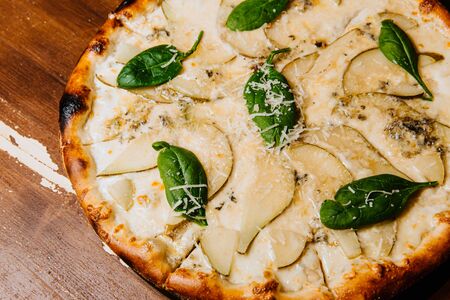 Delicious pizza with pear and blue cheese.の写真素材