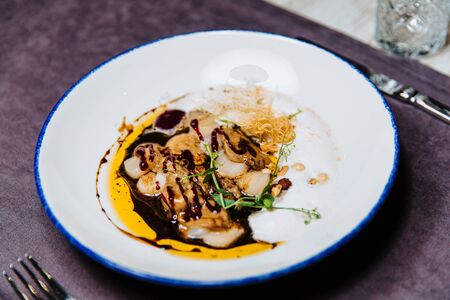 Scallop ceviche and foie gras with hazelnuts.の写真素材