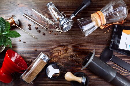 Tool for making professional espresso coffee and coffee beans on a wooden background. Flat layの写真素材