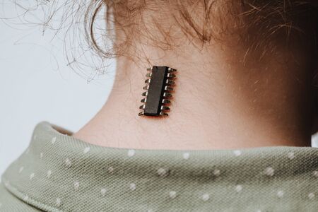 Identification chip and data implanted in a girl. A concept for future technologies aimed at tracking and identifying people. Restriction of freedom.の写真素材