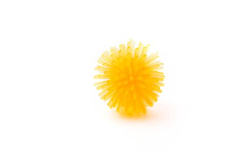 Abstract yellow model of a strain of coronavirus infection on a white background, pandemic risk.の写真素材