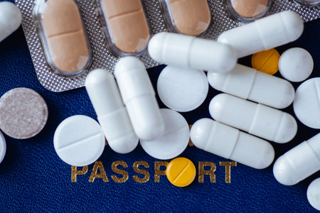 Passport and various pills . Stop traveling to prevent coronavirus. Flat lay
