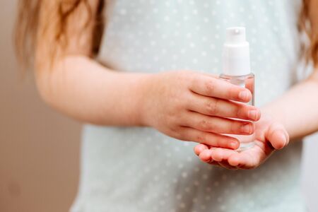 Antibacterial hand remedy in childrens hands.の写真素材