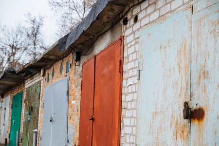 Dneprorudnoe/Ukraine - January 29 2020:Old brick garages with metal gates. Garage cooperative for...