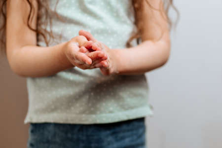 Childrens hands in soapy foam.の写真素材
