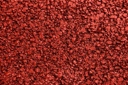 New red asphalt. Textured, background. Flat lay. Close up.の写真素材