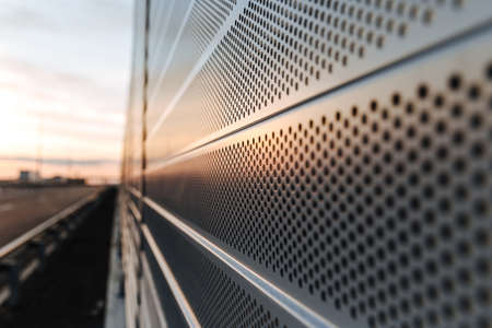 Protection of residents against noise generated by vehicle traffic. Close-up of noise-absorbing protective panels.の写真素材