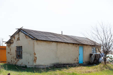 An old run down, weather beaten house that is in need of repair, housing problems.の写真素材