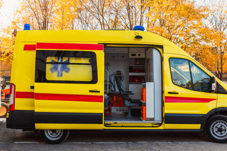 Zaporozhye / Ukraine- November 08 2019: Ambulance with an open door. Ambulance inside. Side view.のeditorial素材