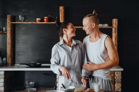 Young couple in love cook healthy food in the kitchen together.の写真素材
