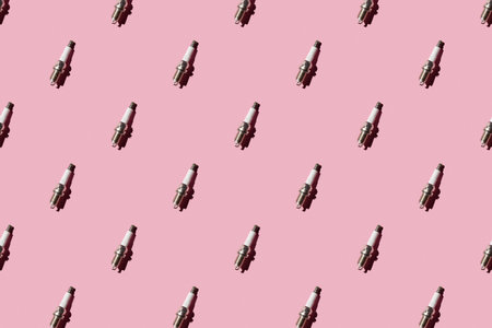 Spark plug pattern on a pink background
