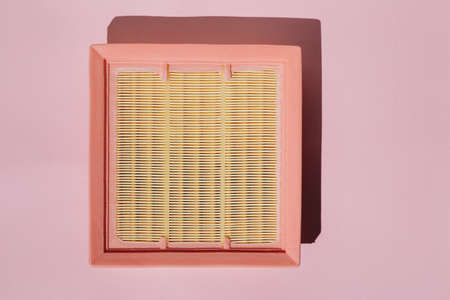 New car air filter on a pink background.の写真素材