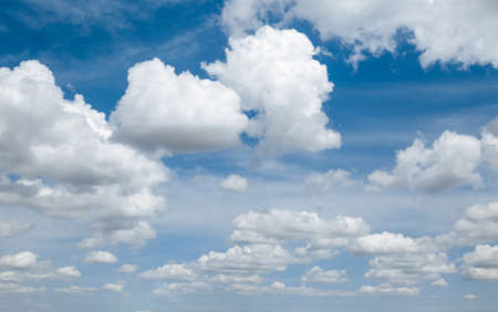 White, Fluffy Clouds In Blue Sky. Background From Cloudsの写真素材