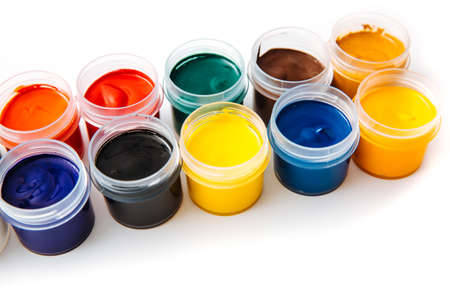 Open jars with gouache of different colors on white background.hobby painting . Learning to draw. Paints gouache.の写真素材