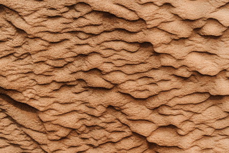 Texture of the sand in the desert. Wavy sand background. Top view