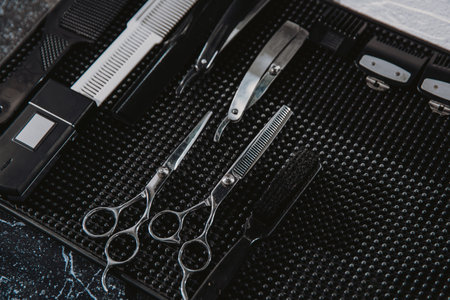 Professional scissors on black background. Hairdressing industry. Professional hairdressing toolsの写真素材