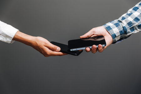 Horishni Plavni, Ukraine - 07, Juny 2022 : Tap to pay. iPhone is used as a payment terminal.のeditorial素材