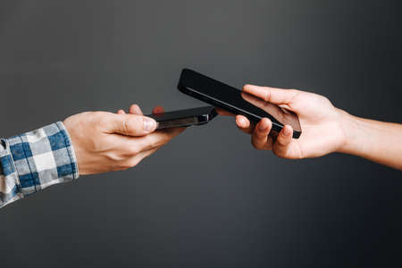 Horishni Plavni, Ukraine - 07, Juny 2022 : Tap to pay. iPhone is used as a payment terminal.のeditorial素材