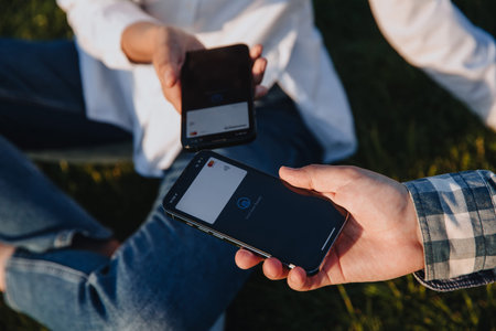 Horishni Plavni, Ukraine - 07, Juny 2022 : Tap to pay. iPhone is used as a payment terminal.