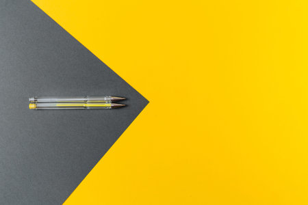 Yellow and gray gel pens.