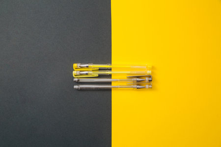 Yellow and gray gel pens.の写真素材