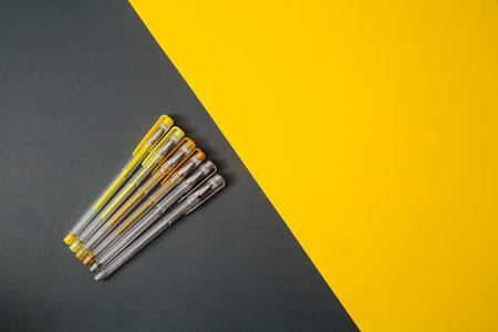 Yellow and gray gel pens.の写真素材