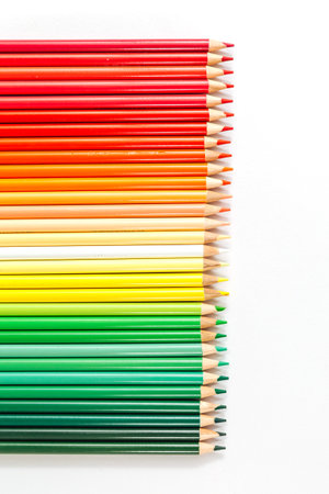 Colored multicolored wooden pencils on a white backgroundの写真素材