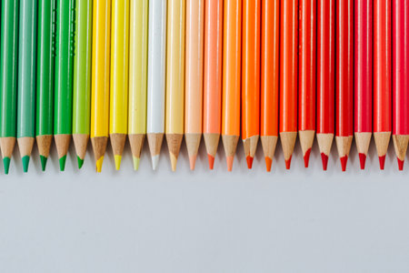 Colored multicolored wooden pencils on a white backgroundの写真素材