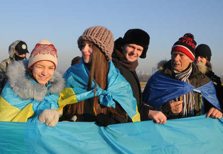 Participants of the action `Unite the banks of the Dnieper` a living chain of` Unity` on the Paton Bridge in Kiev, January 22, 2019.のeditorial素材