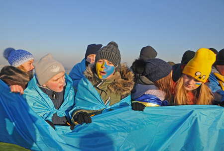 Participants of the action `Unite the banks of the Dnieper` a living chain of` Unity` on the Paton Bridge in Kiev, January 22, 2019.のeditorial素材