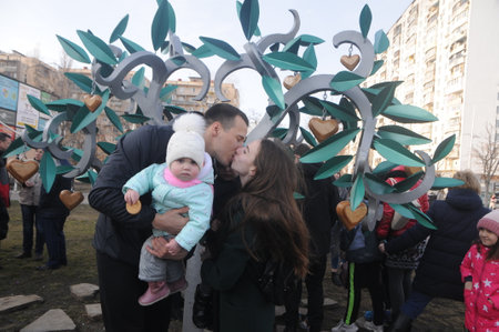 Young couple kisses near the new installation "Place of Kisses" in Kiev, March 7, 2019のeditorial素材