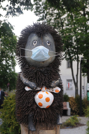 The sculpture "Hedgehog in the Fog" in a medical mask, in Kiev, May 26, 2020のeditorial素材