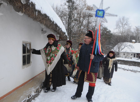 Christmas carols during the Christmas celebration at the National Museum of Folk Architecture and Life in Kiev, January 7, 2019.のeditorial素材