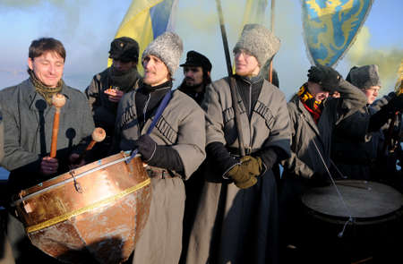 Participants of the action `Unite the banks of the Dnieper` a living chain of` Unity` on the Paton Bridge in Kiev, January 22, 2019.のeditorial素材