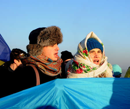 Participants of the action `Unite the banks of the Dnieper` a living chain of` Unity` on the Paton Bridge in Kiev, January 22, 2019.のeditorial素材