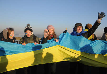 Participants of the action "Unite the banks of the Dnieper" a living chain of "Unity" on the Paton Bridge in Kiev, January 22, 2019.のeditorial素材