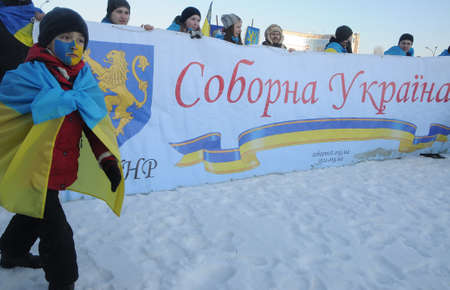 Participants of the action "Unite the banks of the Dnieper" a living chain of "Unity" on the Paton Bridge in Kiev, January 22, 2019.のeditorial素材