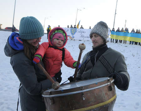 Participants of the action "Unite the banks of the Dnieper" a living chain of "Unity" on the Paton Bridge in Kiev, January 22, 2019.のeditorial素材