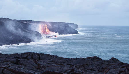 Lava erupting into Pacific Ocean in Hawaii Big Islandの写真素材