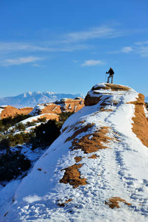 Hiker on top of the mountain in Arches National Park, Utah in winterのeditorial素材
