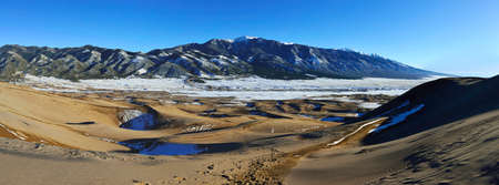 panoramic view of the Great Sand Dunes National Park, Colorado in winterの写真素材