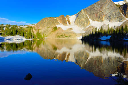 Snowy Range Mountains and lake in Medicine Bow, Wyoming in summerの写真素材